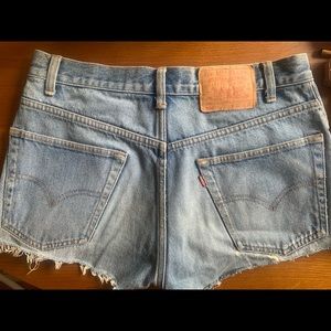 UO Urban Renewal Levi’s Patched Mini Shorts